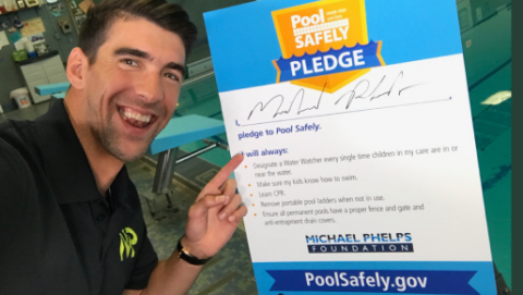 Michael Phelps with his signed pledge.