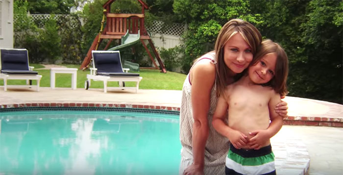 Mother and son in front of pool