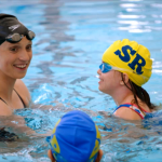 Katie Ledecky swimming with some girls