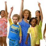 group of kids and laurie berkner in the pool safely song music video.