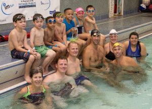 Kids and parents at the pool with Michael Phelps