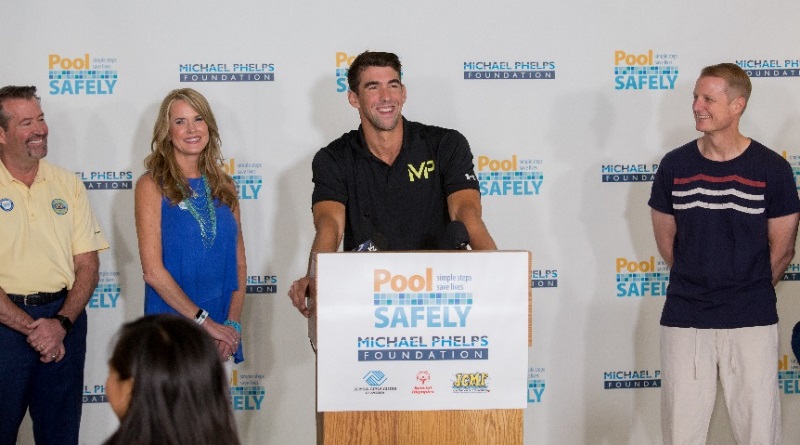 Michael Phelps in front of podium