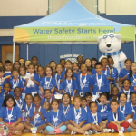 Campers in a gym for Water safety.