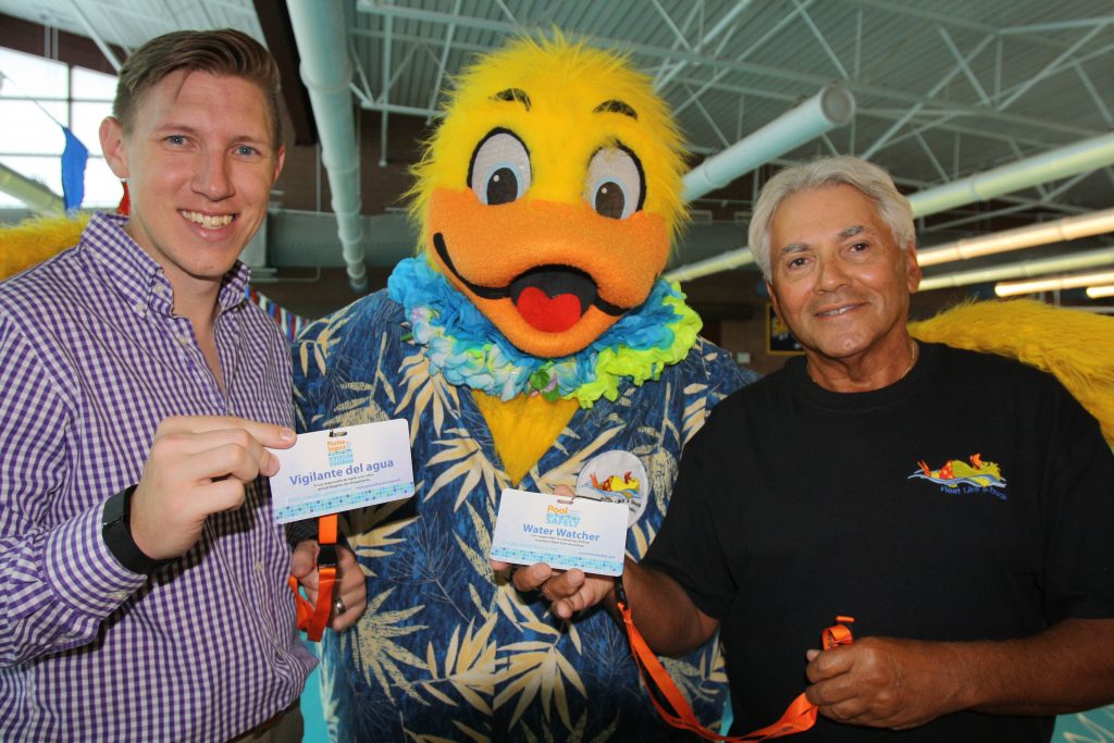 two men and a person in a duck costume.