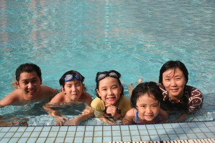 Happy family in the pool