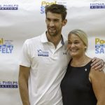 michael phelps and ann marie buerkle smiling.