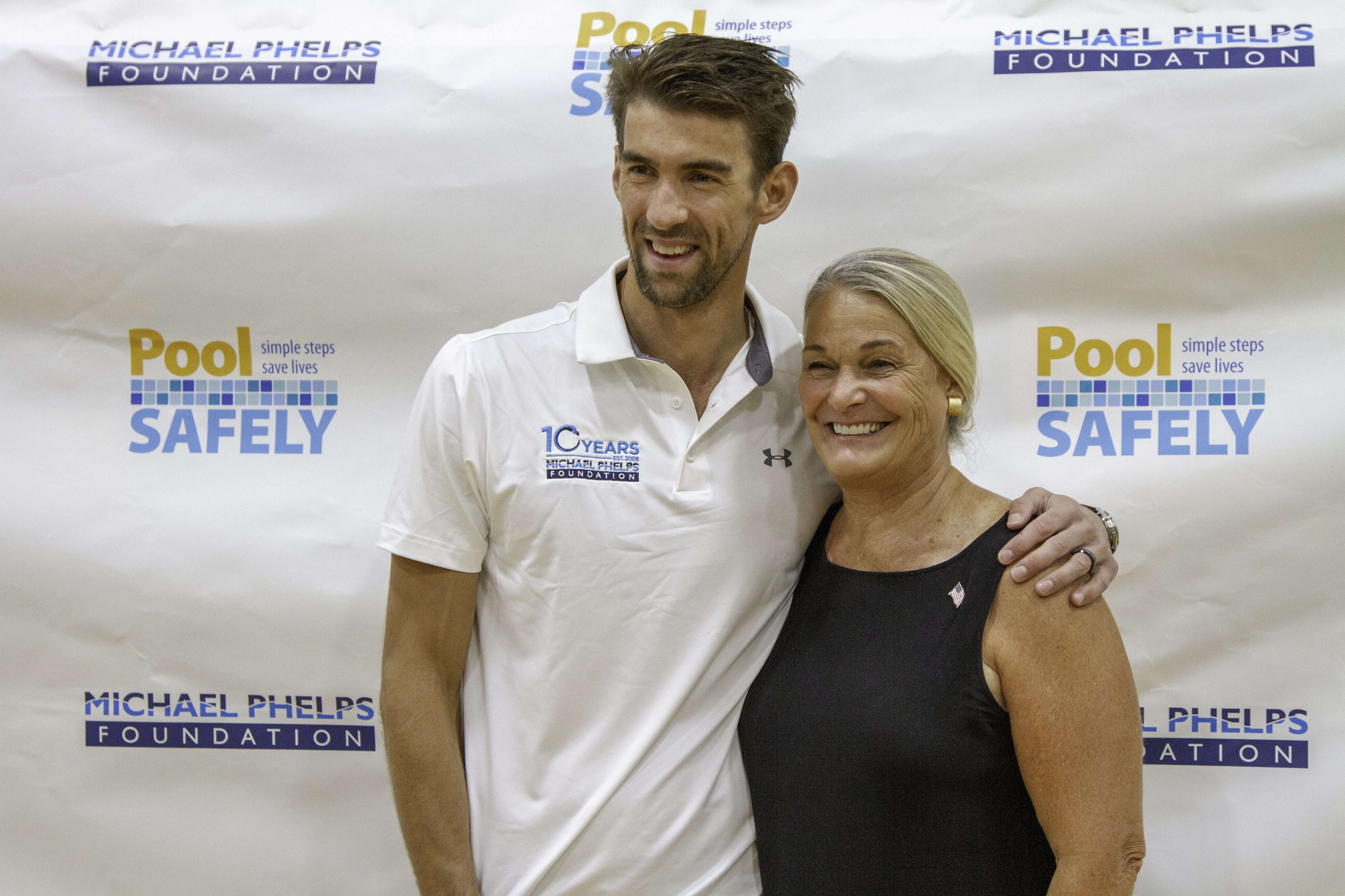 michael phelps and ann marie buerkle smiling.