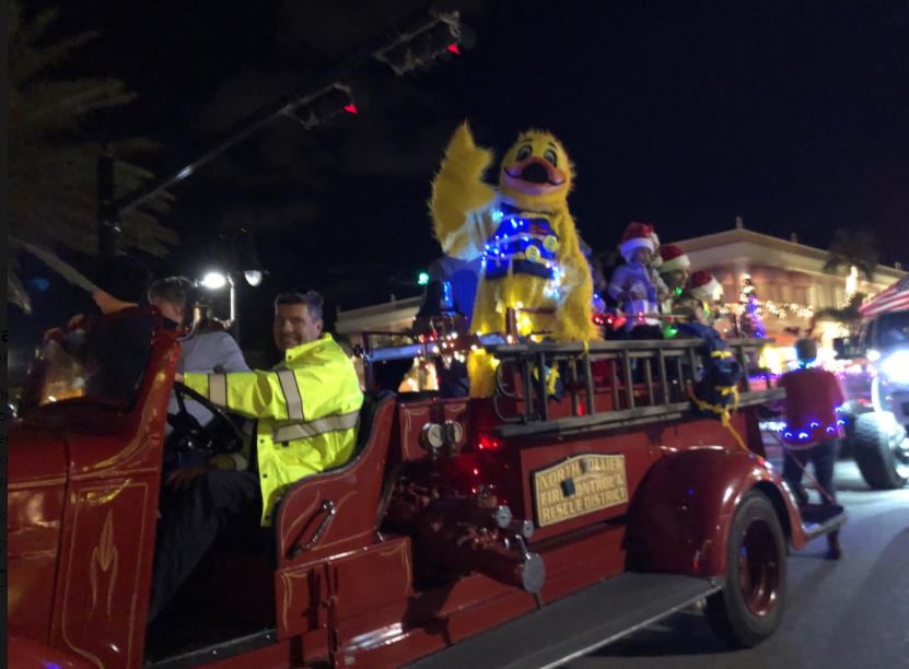 Stewie riding in firetruck