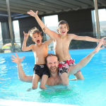 Dad and Kids Swimming.