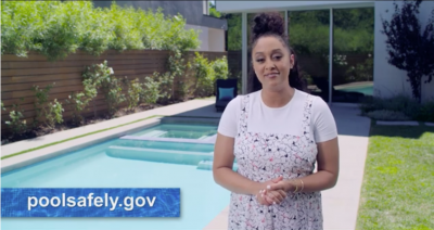 a video still of Tia Mowry next to a pool.