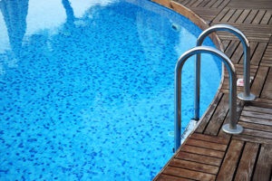 closeup of a pool and pool ladder.