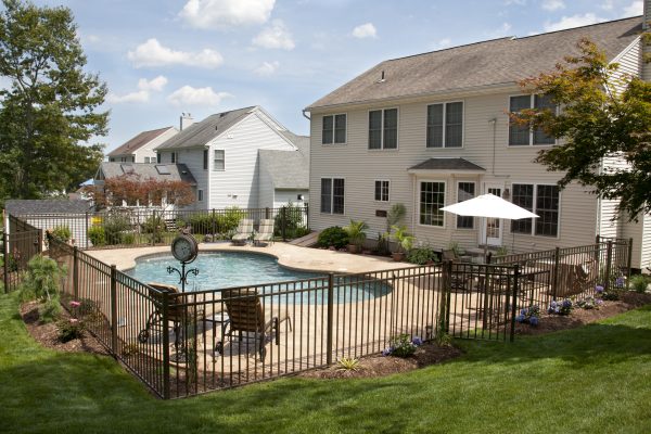 house with pool and pool fence