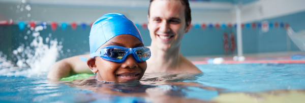 child swimming in a pool